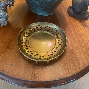 vintage brass ornamental offering plate.