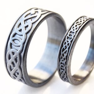 matching viking silver rings for him and her, black silver wedding bands, his and hers engagement rings, celtic knot ring set black silver