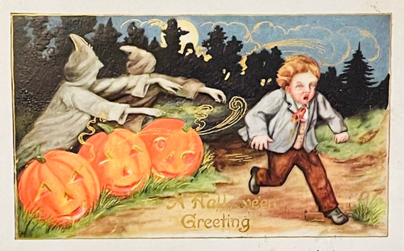 Antique Embossed Halloween Postcard A Joyful Hallowe'en Couple on Jack O' Lantern SERIES 652 embossed postcard Halloween postcard