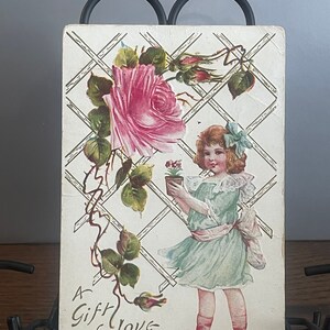 GT11G, Rare, Antique, Lightly Embossed.  Greetings, Postcard, A Gift Of Love, Cute Little Girl, Pink Rose
