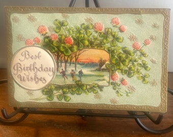 Antieke reliëfverjaardagskaart: schaatsers, roze bloemen, Duitsland (1907-1914) BD20G