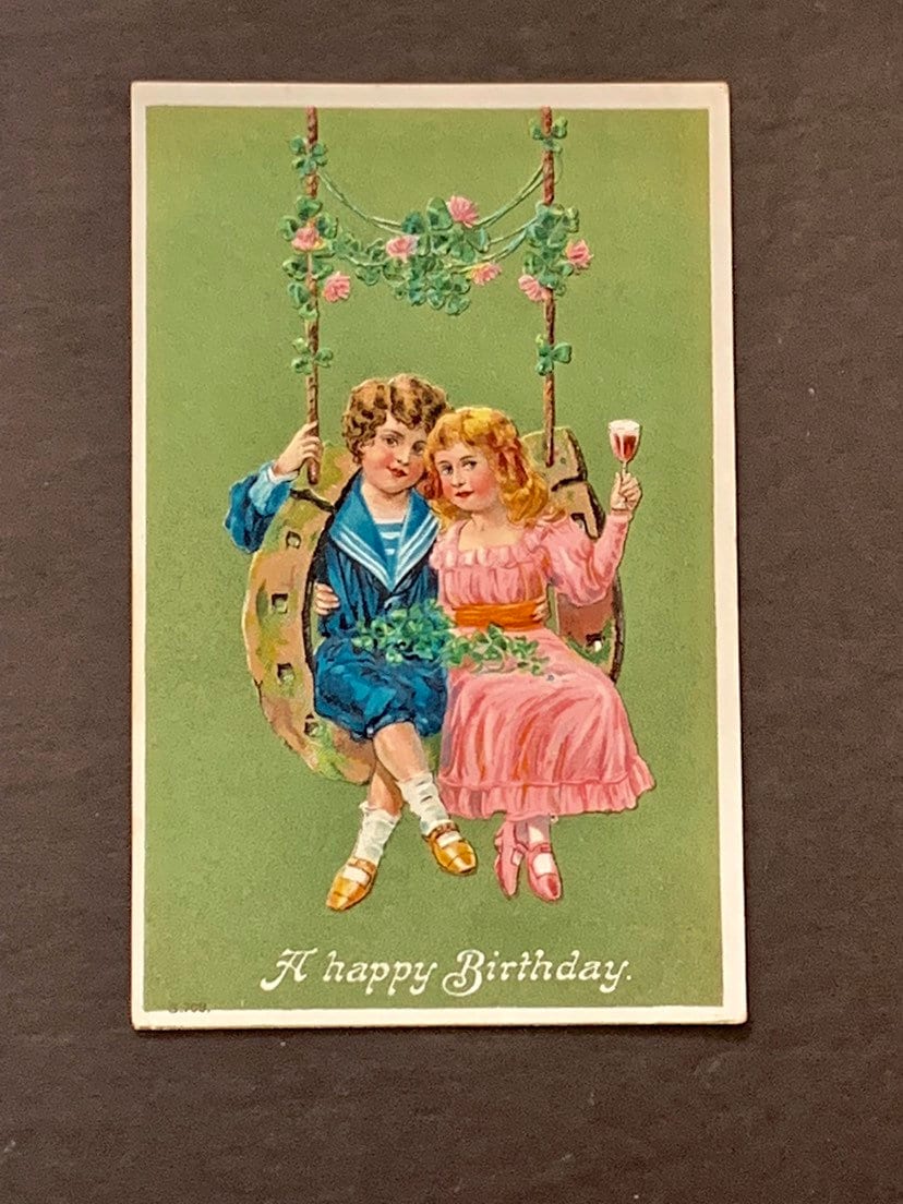Antique Embossed Birthday Postcard: Boy, Girl on Horseshoe Swing