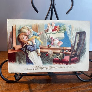 CH49, John Winch, rara cartolina di Natale antica leggermente in rilievo, un buon Natale, Babbo Natale, mongolfiera, madre figlia