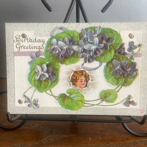 BD45G, Antique, Embossed Birthday Postcard, Birthday Greetings, Little Girl, Purple Flowers And Green Leaves