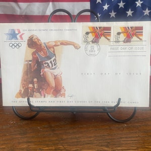Eerste dag van uitgifte, Olympische Spelen 1984, discuswerpen, uitgegeven op 28 juli 1983 Officiële stempel en eerstedagomslag