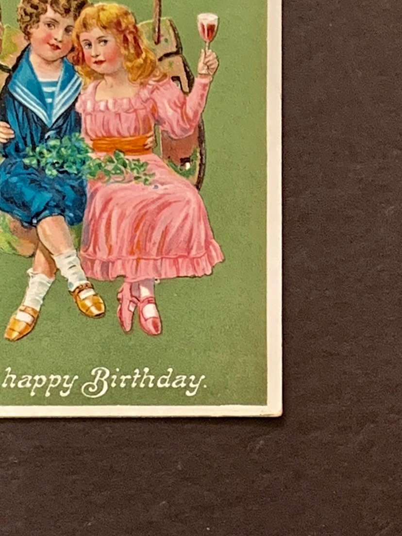Antique Embossed Birthday Postcard: Boy, Girl on Horseshoe Swing