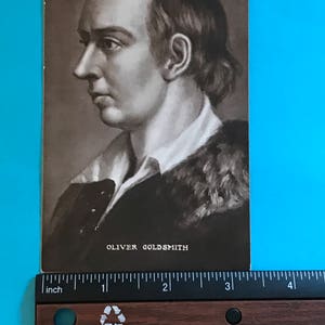 May include: A black and white portrait of Oliver Goldsmith, a famous Irish writer and poet. The image is a vintage postcard.