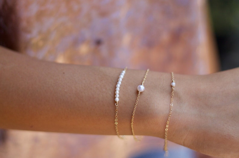Delicate pearl layering bracelets by L.A.Osborn Jewelry Designs modeled at designers studio in Lodi California