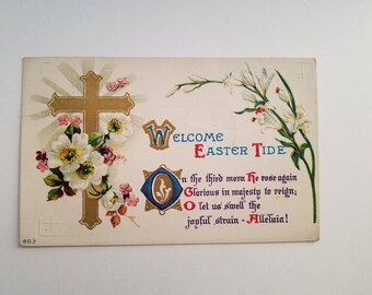 May include: Vintage Easter postcard with a gold cross, white flowers, and the words "WELCOME EASTER TIDE." The card features a religious theme with text that reads "In the third morn He rose again." The overall color scheme is cream, gold, and pastel.