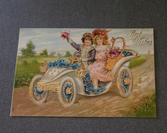 Vintage Embossed Postcard: Boy & Girl in Car, Forget-Me-Not Flowers