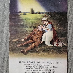 May include: Vintage postcard depicting a World War I scene. A wounded soldier in a brown uniform lies on the ground, attended to by a nurse in a white dress and red cross. The text "Jesu, Lover of My Soul" is visible.