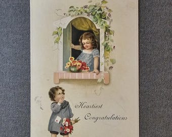 Heartiest Congratulations Embossed Boy & Girl Window Balcony Vintage Ephemera Collectible Postcard