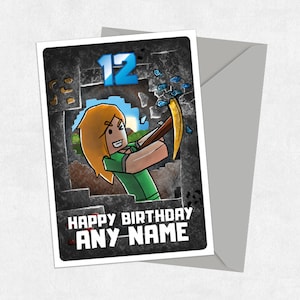 May include: A birthday card featuring a cartoon character holding a pickaxe and breaking through a block of stone. The number 12 is visible in the background. The text "Happy Birthday ANY NAME" is printed on the card.