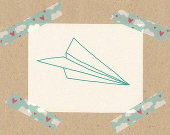 Stamp paper plane / natural rubber on wooden cube 3x3 cm