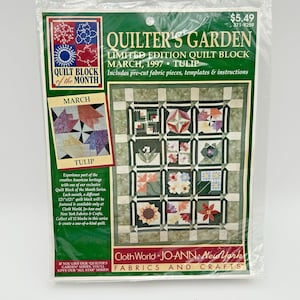 May include: A sealed package for a limited edition "Quilter's Garden" quilt block kit. The package features a quilt block design with floral patterns, the text "March, 1997, Tulip", and the words "Quilt Block of the Month".