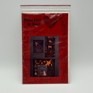 May include: A red and white paper pattern packet with a heart and the text "Pieces From My Heart" on the front. The packet contains three quilt patterns with images of a star, a manger, and a nativity scene. The text "O Holy Night #115" is at the bottom of the packet.