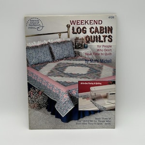 May include: A book cover with a pink and blue quilt on a bed. The title is "Weekend Log Cabin Quilts for People Who Don't Have Time to Quilt" by Marti Michell. It is book three of the "Quilting for People Who Don't Have Time to Quilt" series.