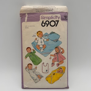 May include: A white ceramic mug with a black handle and the text "But First, Coffee" in a bold, black font. The mug is filled with a dark liquid, likely coffee, and sits on a light-colored surface.