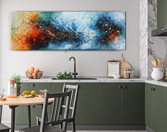 May include: A modern kitchen with green cabinets and a large abstract painting above the counter. The painting features a mix of blue, orange, and yellow colors with black lines and dots. The kitchen also has a dining table with four chairs.