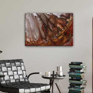 A painting of a guitar with a brown and red background. The guitar is partially obscured by a white, translucent object. The painting is framed and hanging on a wall.