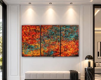 May include: A triptych canvas painting featuring an abstract splatter design with vibrant layers of red, orange, yellow, and teal paint. The artwork displays a chaotic mix of colors and textures across three panels, with the text Nandita Arts visible.