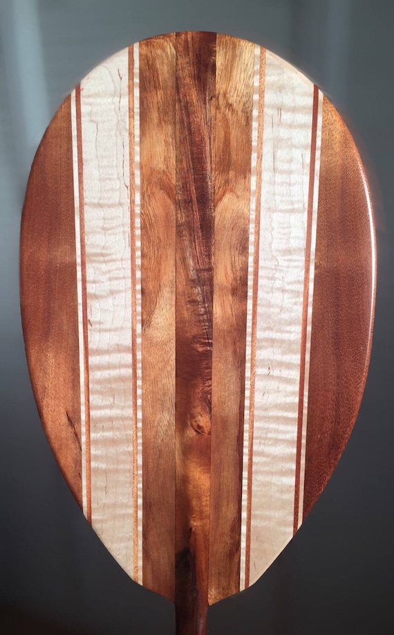 monocoque paddle canoe is crafted of copper-woven carbon