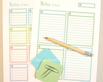May include: Two white paper sheets with the text Notes & lists, featuring colorful bordered sections for writing. A wooden pencil with a metal eraser, two square sticky notes in light blue and green, and two silver metal paper clips are included.