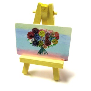 Paleta de flores, una pintura en miniatura y caballete