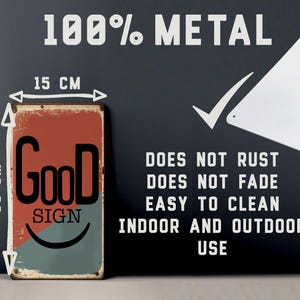May include: A rectangular metal sign, 15 cm wide and 30 cm tall, with the word "Good" in large black letters and "Sign" below. The sign has a red and teal background and text that reads "Does not rust, fade, easy to clean, indoor and outdoor use."