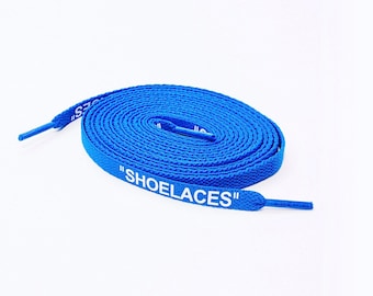 May include: A pair of blue shoelaces with white text that reads "SHOELACES".