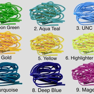 May include: Nine different colors of shoelaces, each color is coiled up in a pile. The colors are neon green, aqua teal, UNC blue, gold, yellow, highlighter yellow, turquoise, deep blue, and magenta.