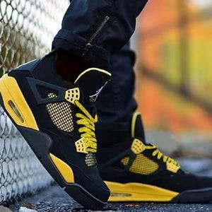 Our custom yellow speckled or yellow cement laces are perfectly paired with the Nike Jordan 4 Yellow Thunder. The speckle or cement print as sneaker enthusiasts like to call it, are an homage to the retro colorways and prints of the original Nike Jordan sneakers that were created in the 1990s.