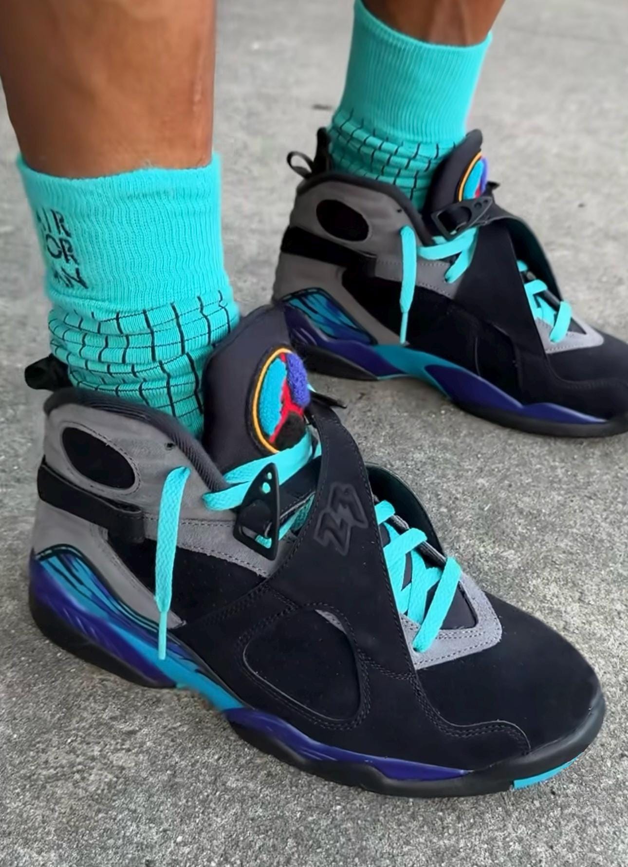 black and turquoise jordans