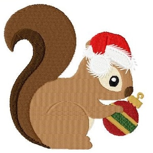 May include: A brown squirrel wearing a red Santa hat with white trim holds a red and green Christmas ornament.