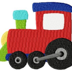 May include: A red toy train with a blue roof, a green smokestack, and black wheels. The train has a white window.