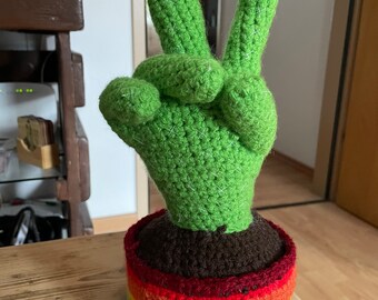 Finished product hand crocheted peace cactus….