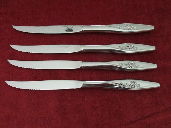 4 Stainless Steak KNIVES From Oneidacraft Deluxe in LASTING ROSE Pattern  Single Rose Handle Pointed Tip Good Condition 