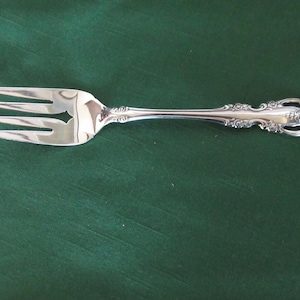 Stainless Meat Serving FORK from ONEIDA Community in the Elegant BRAHMS Pattern Pierced Handles with Flowers and Scrolls Super Condition