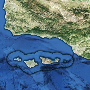 May include: A satellite image of a group of islands in the ocean. The islands are surrounded by a blue body of water and a green coastline.