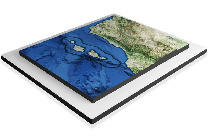 May include: A 3D relief map of a coastal area with a large island in the center. The map is blue and green, with a black frame.