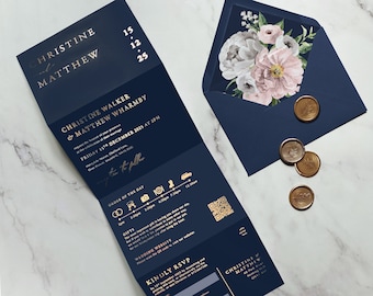 May include: A navy blue wedding invitation with gold foil lettering. The invitation includes the names Christine and Matthew, the date of the wedding, and a QR code. The invitation is folded in thirds and has a white envelope with a floral design.