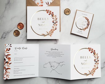 Può includere: Un set di inviti di nozze con un design floreale dorato e marrone. L'invito presenta i nomi "Bella e Noah" in un cerchio dorato con una ghirlanda floreale ad acquerello. La carta RSVP include una mappa con le indicazioni per raggiungere la sede del matrimonio.
