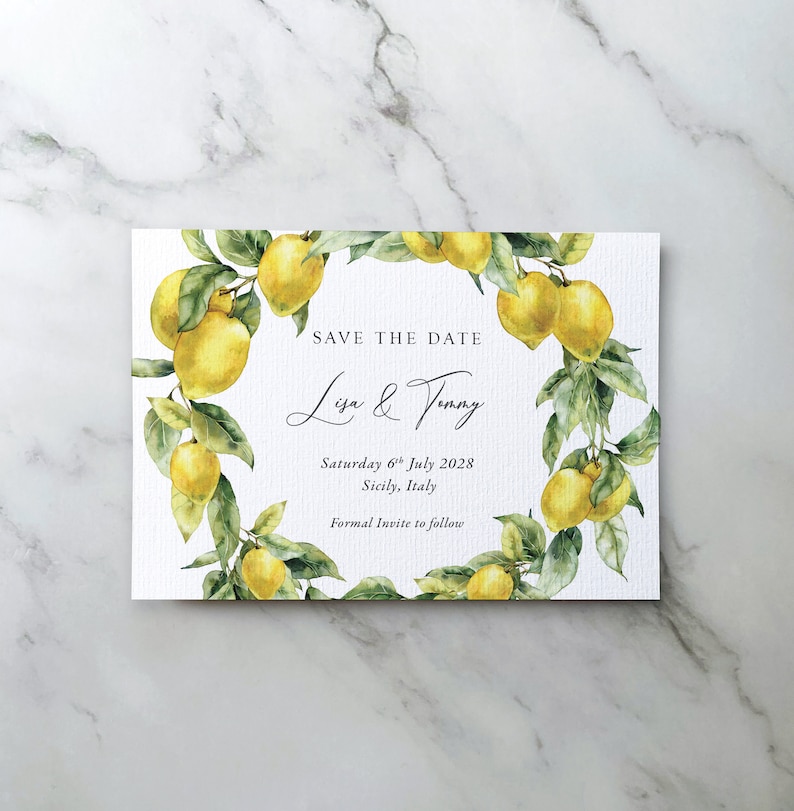 May include: Save the date card featuring a watercolour illustration of a lemon tree branch with yellow lemons and green leaves. The text reads "Save the Date, Lisa & Tommy, Saturday 6th July 2028, Sicily, Italy, Formal Invite to follow."