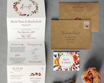 Può includere: Un invito di nozze piegato con un design floreale ad acquerello in tonalità arancio, rosso e marrone. L'invito presenta i nomi della coppia, "Amelia & Harold", e la data del matrimonio, "First September, 2025".