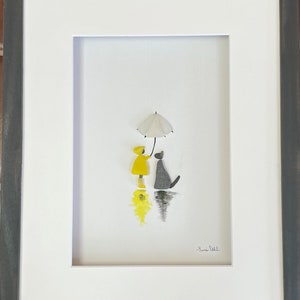 Pebble Art Boy or Girl in Yellow Raincoat with Dog
