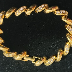 Pre 1990&#39;s Joan Rivers Gold Tone and Rhinestone Curved Bar Tennis Bracelet