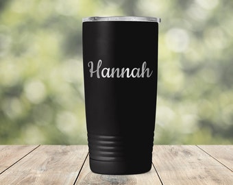 May include: Black stainless steel tumbler with a silver inscription that reads "Hannah".
