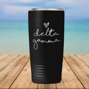 May include: Black stainless steel tumbler with a silver heart and the text "delta gamma" on the side.