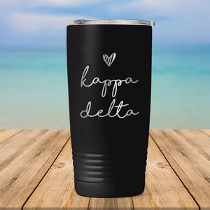 May include: Black stainless steel tumbler with a silver heart and the text "kappa delta" in a handwritten font.