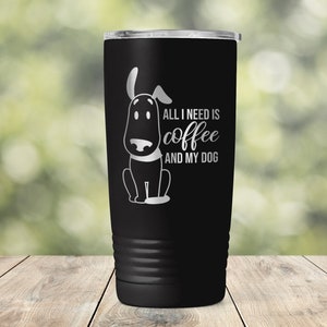 May include: Black stainless steel tumbler with a white graphic of a dog and the text "All I need is coffee and my dog".